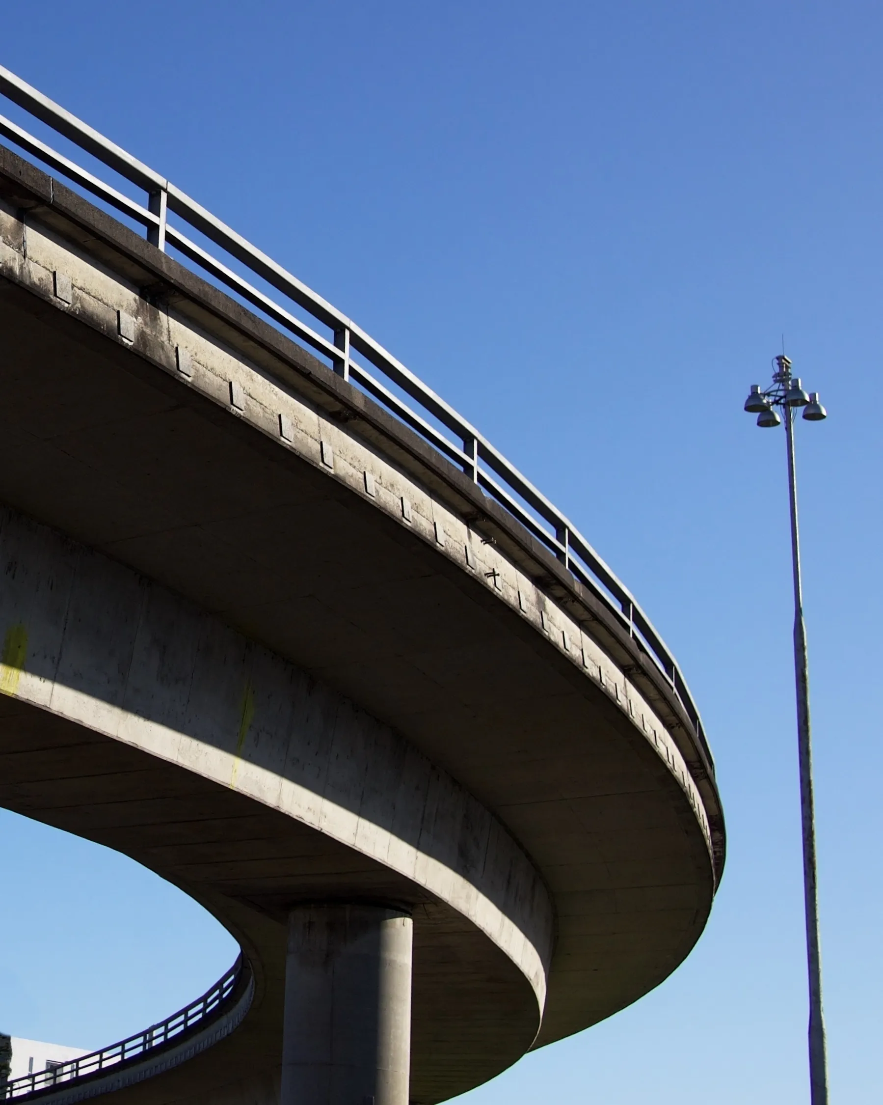 A highway overpass caught by the light and casting deep shadows.