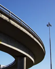 A highway overpass caught by the light and casting deep shadows.